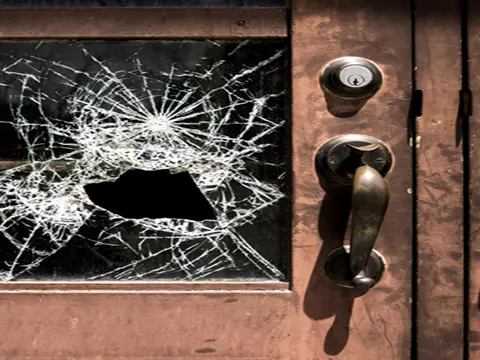 image of a deadbolt lock on a broken door - Deadbolt by Valerie Bacharach